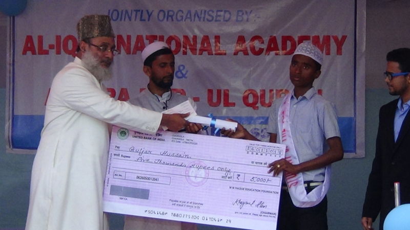 Guljar Hussain  student of AINA receiving Student of the year award
